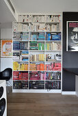 Bookshelf sorted by color in a modern living room