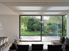 Open-plan living area with garden view, London