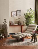 Fabric lounger in a modern reading room with plants and carpet