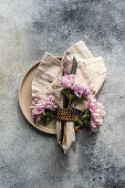 Rustic table setting with chrysanthemums and linen napkin