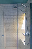 Shower with white metro tiles and glass partition