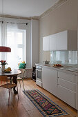 Rustic dining table in white kitchen