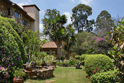 Lush garden and house with natural stone façade, The Sorsbie Residence, Nairobi