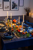 Autumnal decorated table with pumpkins and candlesticks