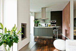 Open living area with kitchen and fireplace, Hamburg, Germany