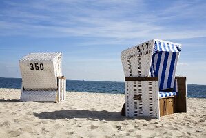 Canopied beach chairs by the sea