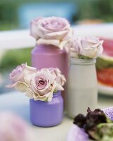 Roses in painted jars