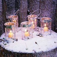 Candle lanterns in snow