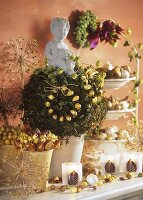 Autumn decoration: bulbs, putto and tealights