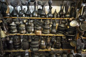 Middle Eastern jugs, pots and pans on a market stall