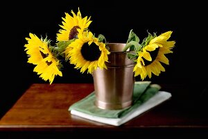 Sunflowers in metal bucket