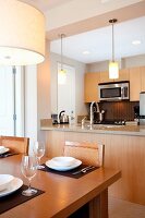 Dining Area and Kitchen of Watermark Beach Resort Luxury Guestroom in British Columbia's Wine Region