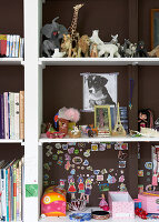 Shelves with toys, books and DIY children's room decorations