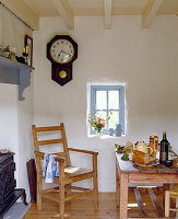 Rustic dining area with wooden furniture and vintage wall clock