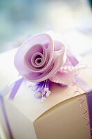 Delicate fabric flower on gift box