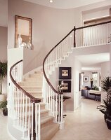 Staircase with white railings in contemporary house