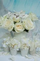 Bouquet of white hydrangeas and roses in white jug