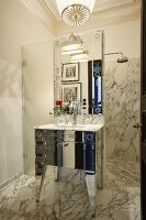 Shower area and vintage-style sink in elegant marble bathroom