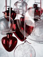 Red glass love-hearts and transparent Christmas baubles
