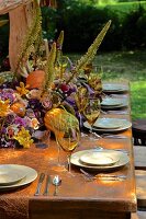 Autumnally set dining table outside barn (USA, East Coast, New England)