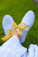 White shoes with laces made from bandanas