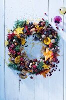 A Christmas wreath with biscuits and berries