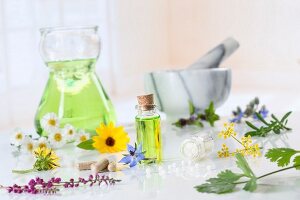 Various medicinal flowers, herbs, oils and vitamin tablets