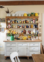 Collection of ceramic animals on rustic dresser