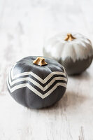 Pumpkins painted grey with white pattern and grey ombré