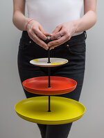 A homemade cakestand made from colourful plates
