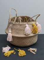 A basket decorated with homemade tassels