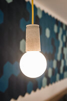 A homemade lamp with a concrete fitting