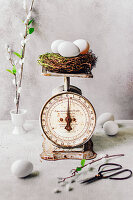 A vintage kitchen scale with an Easter basket
