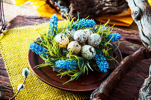 Fresh eggs with flower on plate