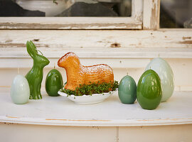 Easter-lamb sponge cake and Easter decorations on windowsill