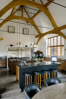 Converted kitchen with high oak ceiling beams