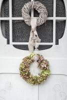 Hydrangea wreath on white wooden door