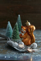 Christmas truffles, squirrel-shaped bauble and tiny Christmas trees