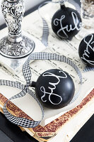 Black Christmas balls with 'Jul' lettering