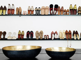 View over trays of shelves with women's shoes on display