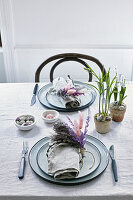 Napkin rings made from willow twigs and flowering grasses on Easter table