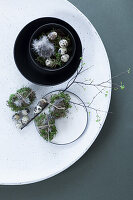 Easter decoration with moss and quail eggs