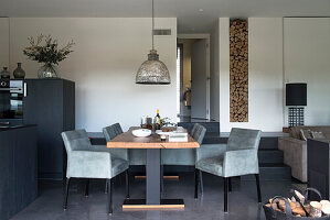 Split-level dining area with elegant upholstered chairs