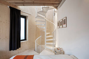 Spiral staircase in bedroom