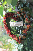 Berry heart made from rose hips and berries from firethorn, dogwood, crab apple and ivy buds with a welcome sign