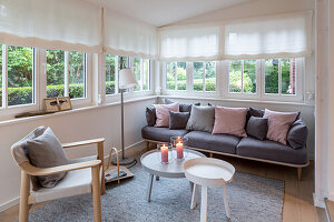 Scandinavian-style living room with wrap-around window strip