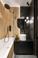 Small bathroom with wood panelling and black marble