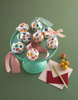 Christmas balls decorated with acrylic paints and satin ribbons