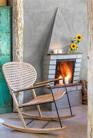 Rocking chair in front of fireplace