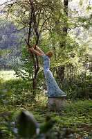 Sculpture of a dancer in garden